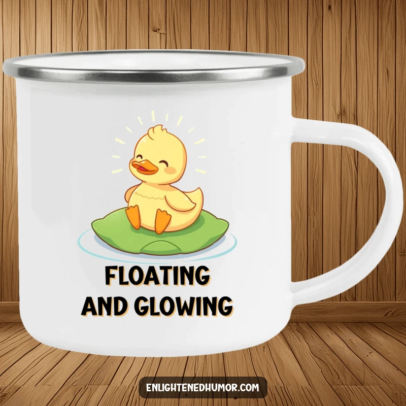 Funny Content Duck Camping Mug: Sturdy mug with a glowing content duck on a lily pad, radiating campfire humor. Perfect funny gift.