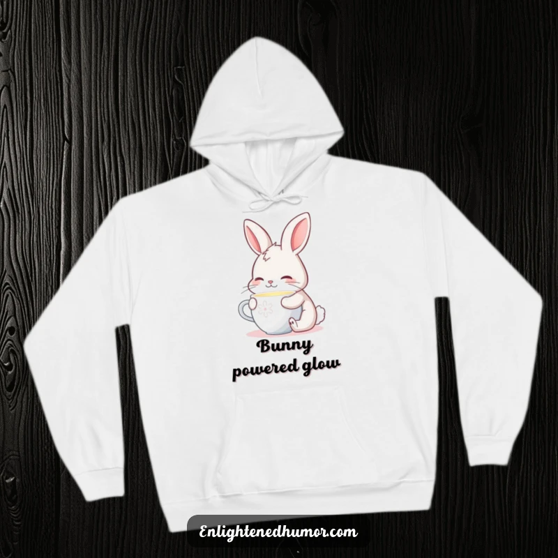Funny hoodie with a contented bunny sipping from a cup that emits a gentle, warm, and comforting glow.