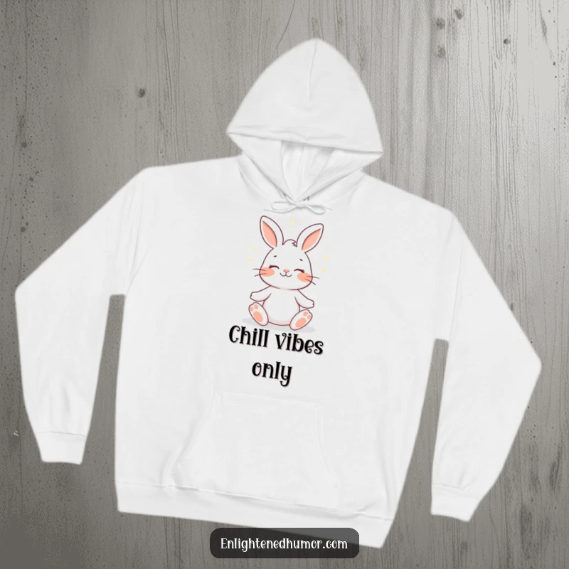 Funny rabbit hoodie design featuring a smiling rabbit meditating peacefully with a gentle halo of light, symbolizing inner calm and humor.