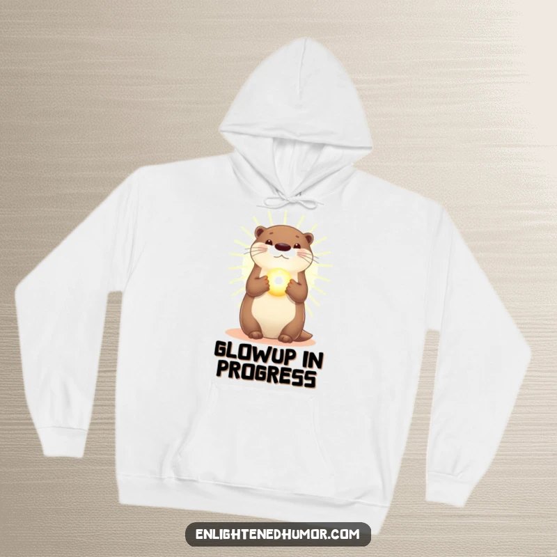 Funny Otter Hoodie: Comfortable hoodie featuring a radiant otter in golden light, holding a glowing orb, very peaceful.