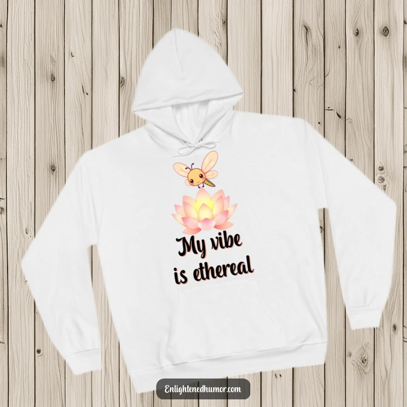 Funny kawaii dragonfly hoodie featuring a cute insect over a glowing lotus, offering warmth and whimsical, peaceful design.