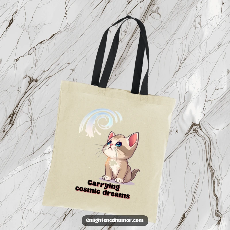 Funny tote bag illustrated with a curious kitten looking up at swirling, luminous celestial patterns, ready for adventure.